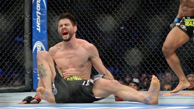 031914-UFC-Carlos-Condit-kicked-by-Tyron-Woodley-HF-PI.vresize.1200.675.high_