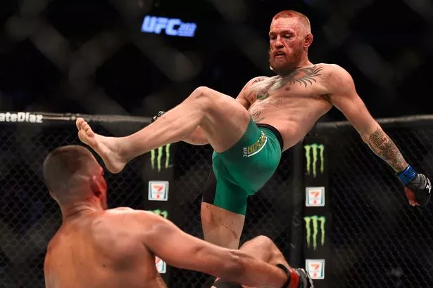 Conor McGregor of Ireland fights Nate Diaz in their welterweight bout during the UFC 202